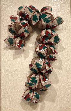 a christmas wreath made out of fabric on the wall