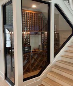 the inside of a wine cellar with stairs leading up to it