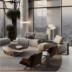 a living room filled with lots of furniture and large windows overlooking the cityscape