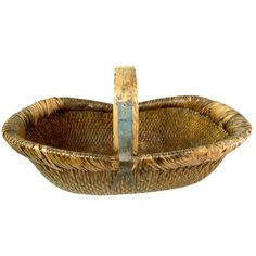 an old woven basket with two handles on the bottom and one handle in the middle