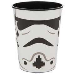 a star wars themed cup with a storm trooper face on the front and black bottom