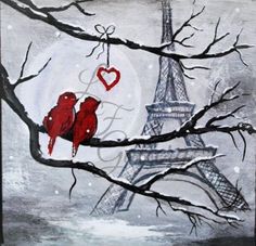 two red birds sitting on a tree branch in front of the eiffel tower