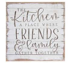 a wooden sign that says the kitchen is place where friends and family gather together