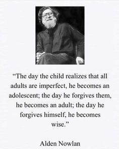 an older man with glasses and a beard sitting in front of a quote from the book