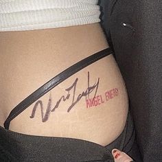 a woman's stomach with the words angel energy written on it and an arrow