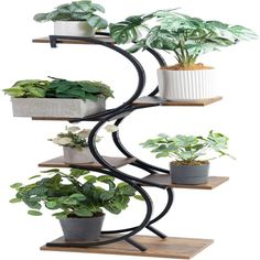 three tiered plant stand with potted plants on it