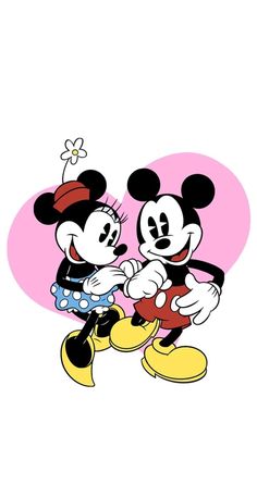 two mickey and minnie mouses are touching each other's hands in front of a heart