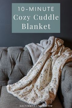 a couch with a blanket on it and the words 10 minute cozy cuddle blanket