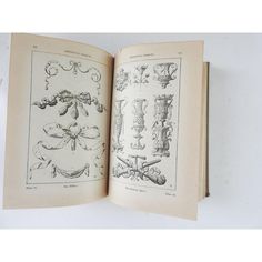 an open book with drawings on it