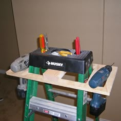 a work bench with tools on it and a tool box sitting on top of it