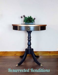 a table with a potted plant sitting on top of it