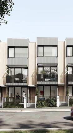 an apartment building with balconies on the second floor