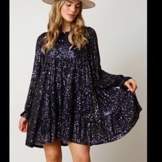 Description: This Stunning Navy Dress Features Sequins And A Flowy Design, Creating An Elegant Aesthetic. Perfect For A Special Occasion, The Best Believe I'm Still Bejeweled Dress Will Make You The Star Of The Show. Details: Loose Fit Tiered Sequin Dress, Long Sleeves, Tiered Bottom Fit: Loose Fit Content: 95% Polyester 5% Spandex. Blue Sequin Dress For Date Night In Spring, Blue Sequin Dress For Holiday Party, Blue Sequined Dresses For Holiday Party, Chic Blue Dress For Holiday Party, Blue Embellished Dress For Date Night, Blue Sequin Dress For Fall, Glamorous Blue Mini Dress For Fall, Best Believe I'm Still Bejeweled, Bejeweled Dress