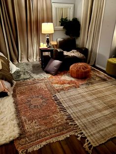 a living room filled with furniture and rugs