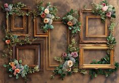 four frames decorated with flowers and greenery