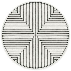 a round rug with black and white lines on it