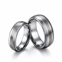 two silver wedding rings on white background