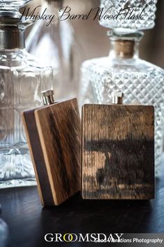 two wooden flasks sitting on top of a table