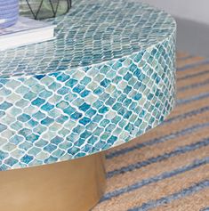 a blue and white table with a book on top