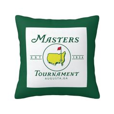 a green and white pillow with the words masters golf tournament on it's side