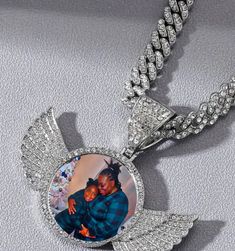 "Add your favorite person and keep the memories going with this custom sublimation picture pendant necklace. Product description: CZ Angel Wings/Heart/Medallion Memory Pendant Hip Hop Jewelry *Cubin Link chain is 18 Inches Zinc Alloy Gold plated, Rose gold plated, Silver plated over Copper Gemstone: Cubic zirconia  This listing is for Circle Angel Wings as pictured. Each pendant comes with matching 18-22\" necklace chain.  PLEASE send HIGH QUALITY photos as described. Picture will be sized down Angel Wings Craft Jewellery My Family Are My Abgels, Cheap Personalized White Jewelry, Cheap Customized Necklace As Gift, Luxury Spiritual Necklaces For Memorials, Luxury Memorial Jewelry With Engraving Option, Pendant Picture Necklace, Luxury Custom Necklace As Gift, Cheap Custom Silver Necklace, Luxury White Gold Necklace For Memorials