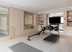 a home gym with treadmills and exercise equipment