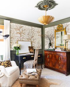 a living room filled with furniture and a chandelier