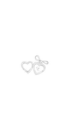 two heart shaped earrings on a white background