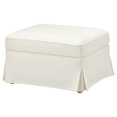 a white ottoman with a pleaed skirt on it