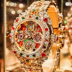 This exquisite artwork, portraying a high-end fashion wristwatch, is a dazzling representation of opulence and precision. The watch is encrusted with a multitude of sparkling gemstones, including diamonds, rubies, and emeralds, creating a kaleidoscope of colors and light. The intricate craftsmanship of the watch face, with its multi-tiered dials and jeweled accents, elevates the timepiece from a mere accessory to a statement of luxury and sophistication. Welcome to my high-concept art for the wall, shelf, Digital Picture frame, or computer desktop wallpaper.  Art Description: Bejeweled Time is a luxurious depiction of a high-fashion wristwatch that exudes elegance and wealth. The watch face is an intricate tapestry of gemstones, each dial meticulously crafted with precision and adorned wit Watch Concept Art, Watch Concept, Digital Picture Frame, Computer Wallpaper Desktop Wallpapers, High End Fashion, Free Art, Watch Design, Time Piece, Fashion Designer