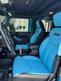 the interior of a vehicle with blue seats