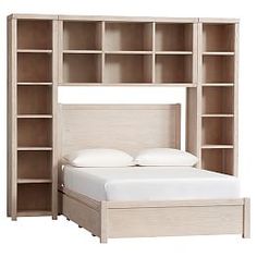 a bed with a bookcase above it