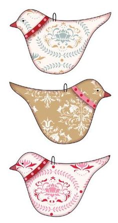 three birds with different patterns on them, one is brown and the other is pink