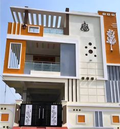 a white and orange building with black doors