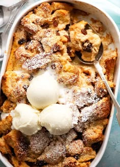 a casserole dish with ice cream in it and spoons on the side