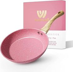 the pink bowl is next to its box