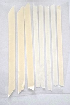 several strips of white paper are laid out