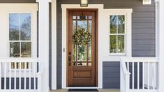 a front door with a wreath on it