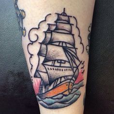 a tattoo on the leg of a person with a ship