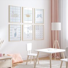 a white table and chairs in a room with pictures on the wall above it,