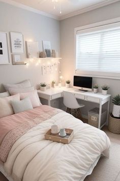 a bedroom with a bed, desk and computer on the table in front of it