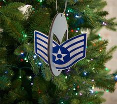 an ornament hanging from the top of a christmas tree