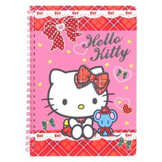 a pink notebook with hello kitty on it