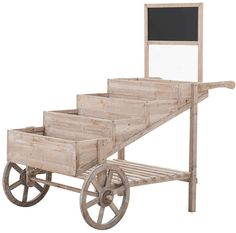 an old wooden cart with a chalkboard on top