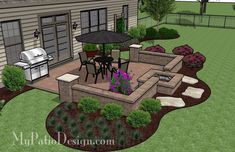 an outdoor patio and grill area in the middle of a yard with landscaping around it