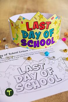 a paper crown sitting on top of a table next to some confetti and beads