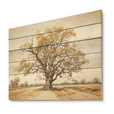 a tree painted on wooden planks in front of a white background with brown and yellow leaves