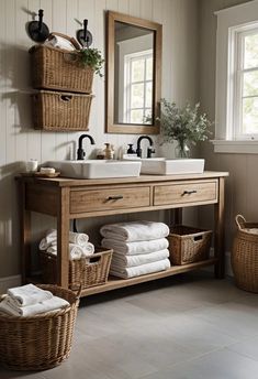 a bathroom with two sinks and baskets on the counter