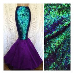 an image of a mermaid costume with green and purple sequins on the skirt