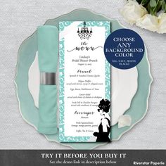 the wedding program is displayed on a plate with white flowers and blue napkins next to it